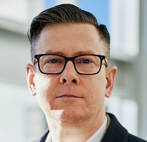 Alexander Hughes, CEO and executive at a crypto trading company, portrait